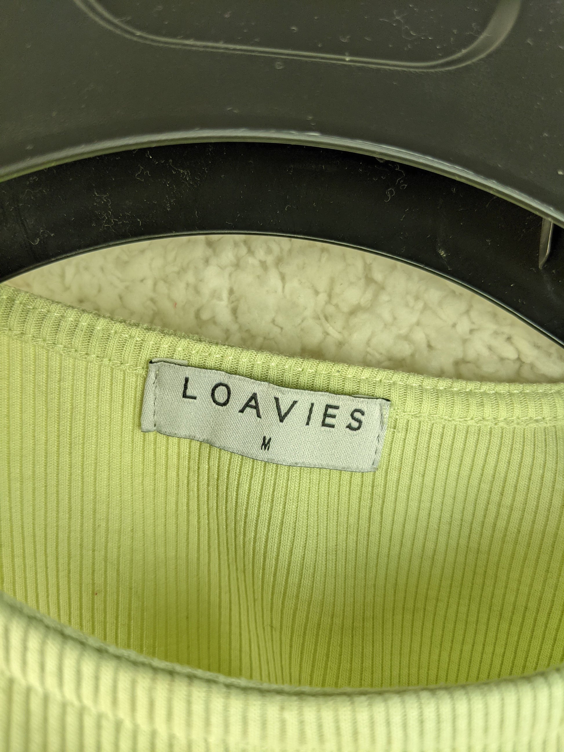 Close-up of Loavies label in mint green top