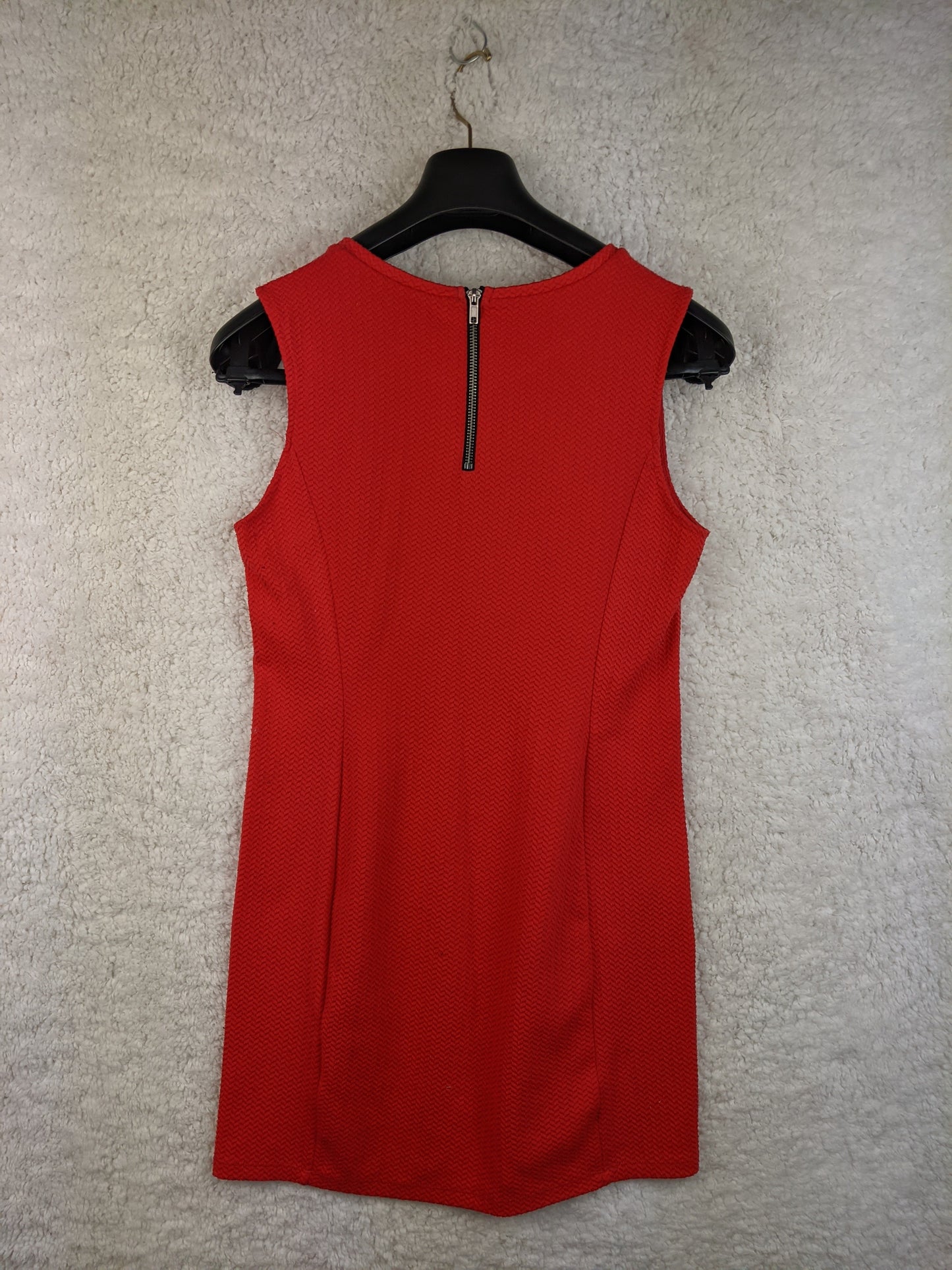Back view of red sleeveless dress with zipper