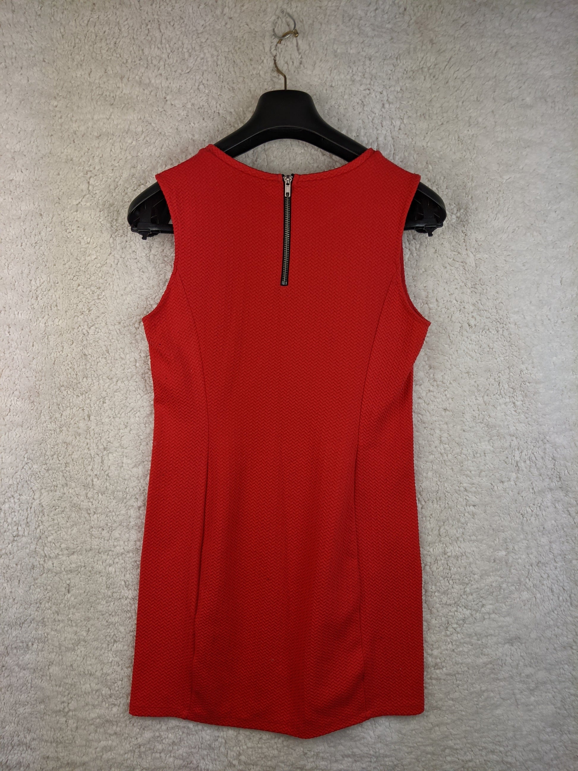 Back view of red sleeveless dress with zipper