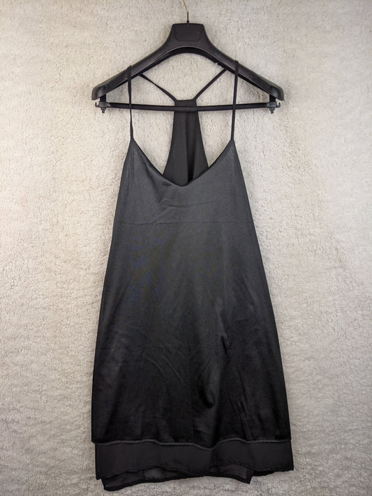 Front view of black slip dress on hanger