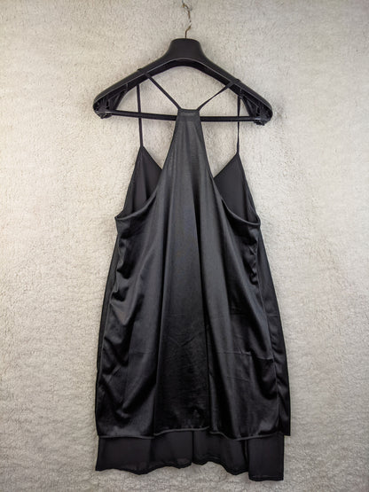 Back view of black slip dress on hanger