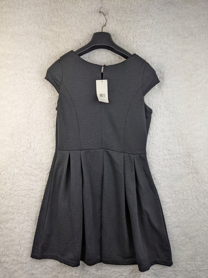 Back view of black dress on hanger