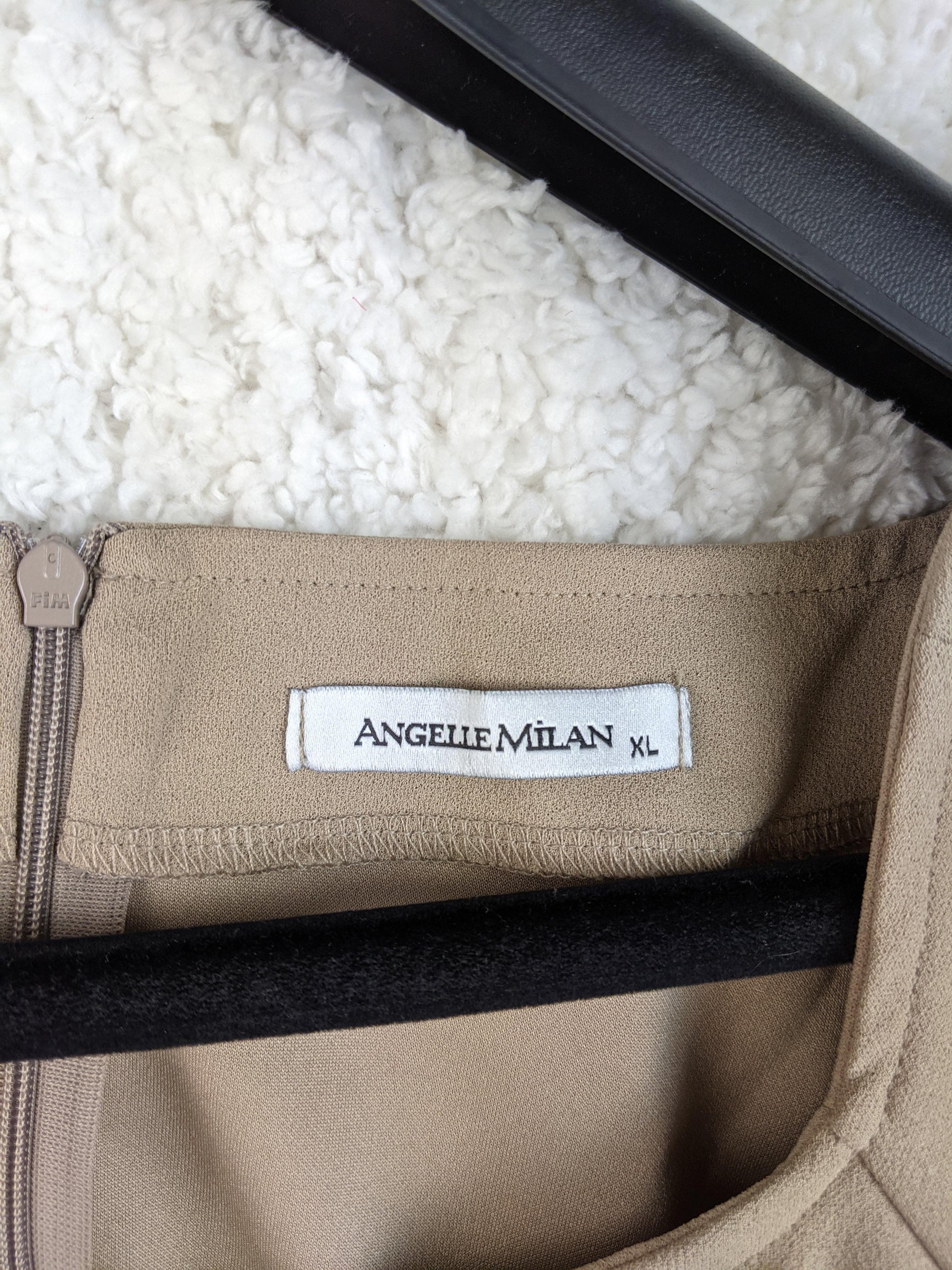 Close-up of Angelle Milan label