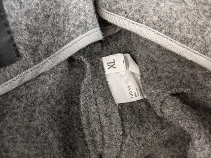 Size tag showing XL and 100% wool composition