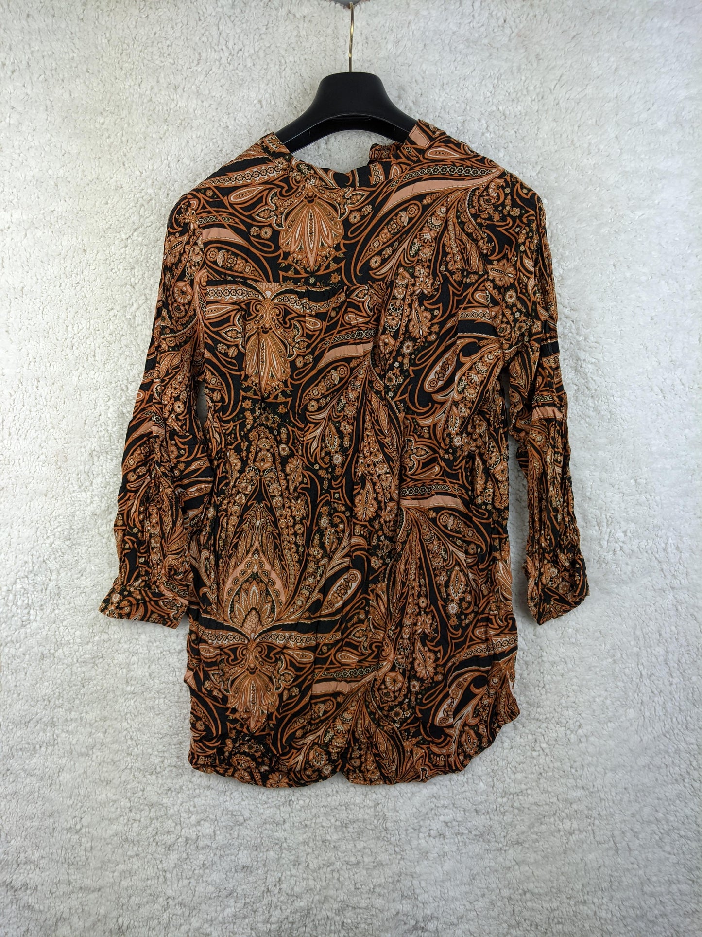 Back view of H&M boho blouse on hanger