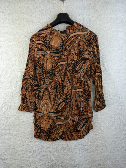 Back view of H&M boho blouse on hanger
