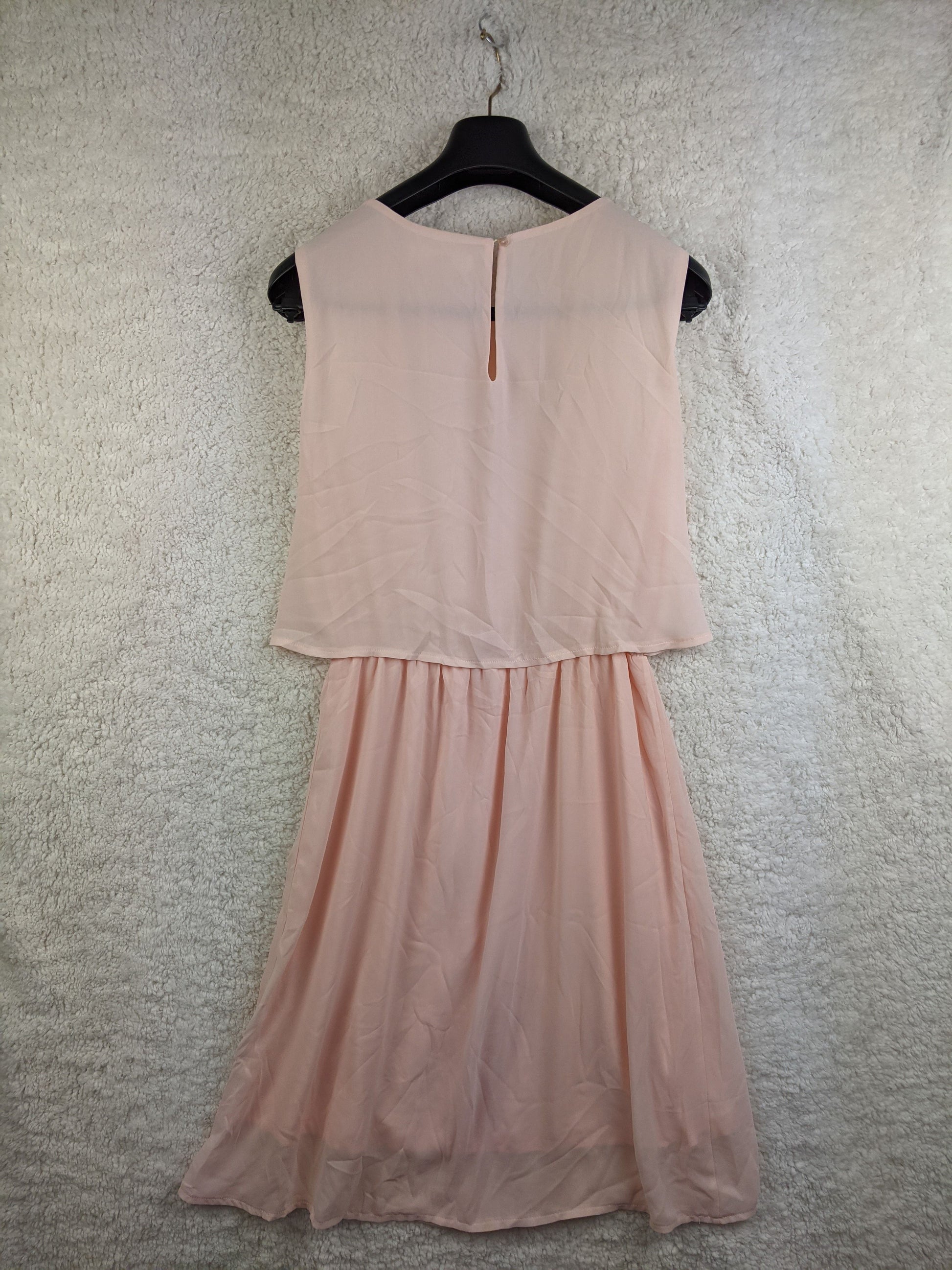 Back view of light pink sleeveless dress