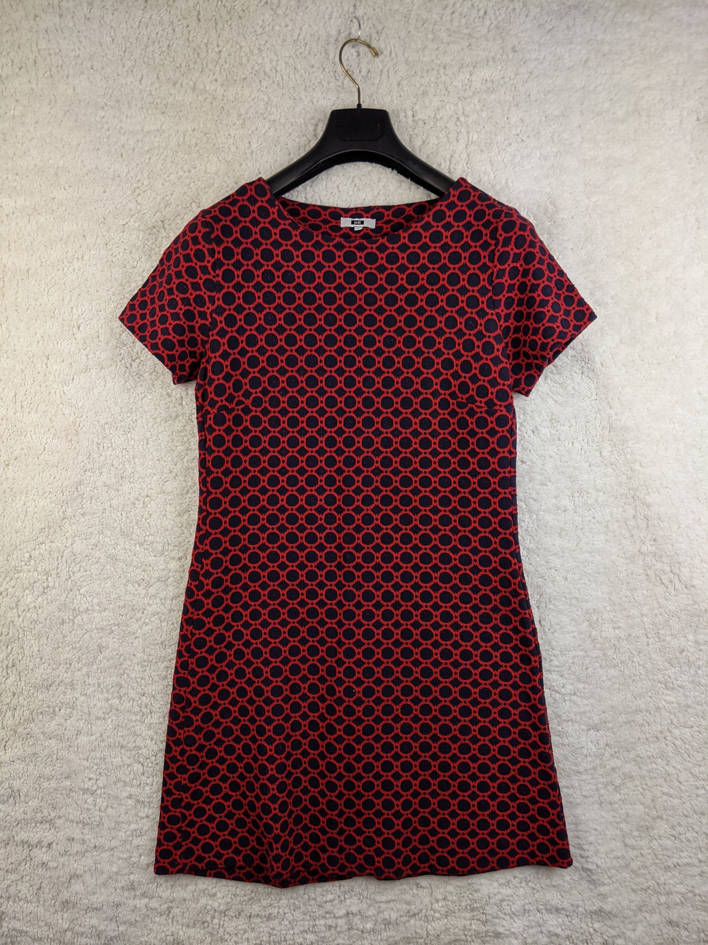 Front view of red and black patterned dress
