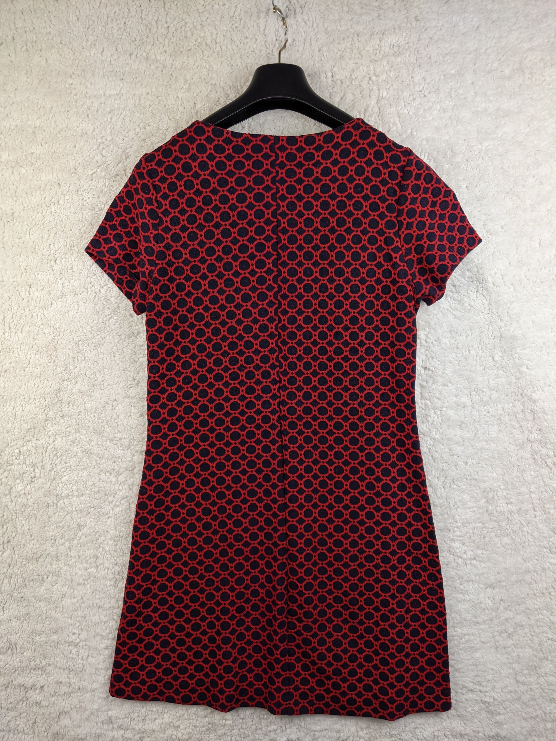 Back view of red and black patterned dress