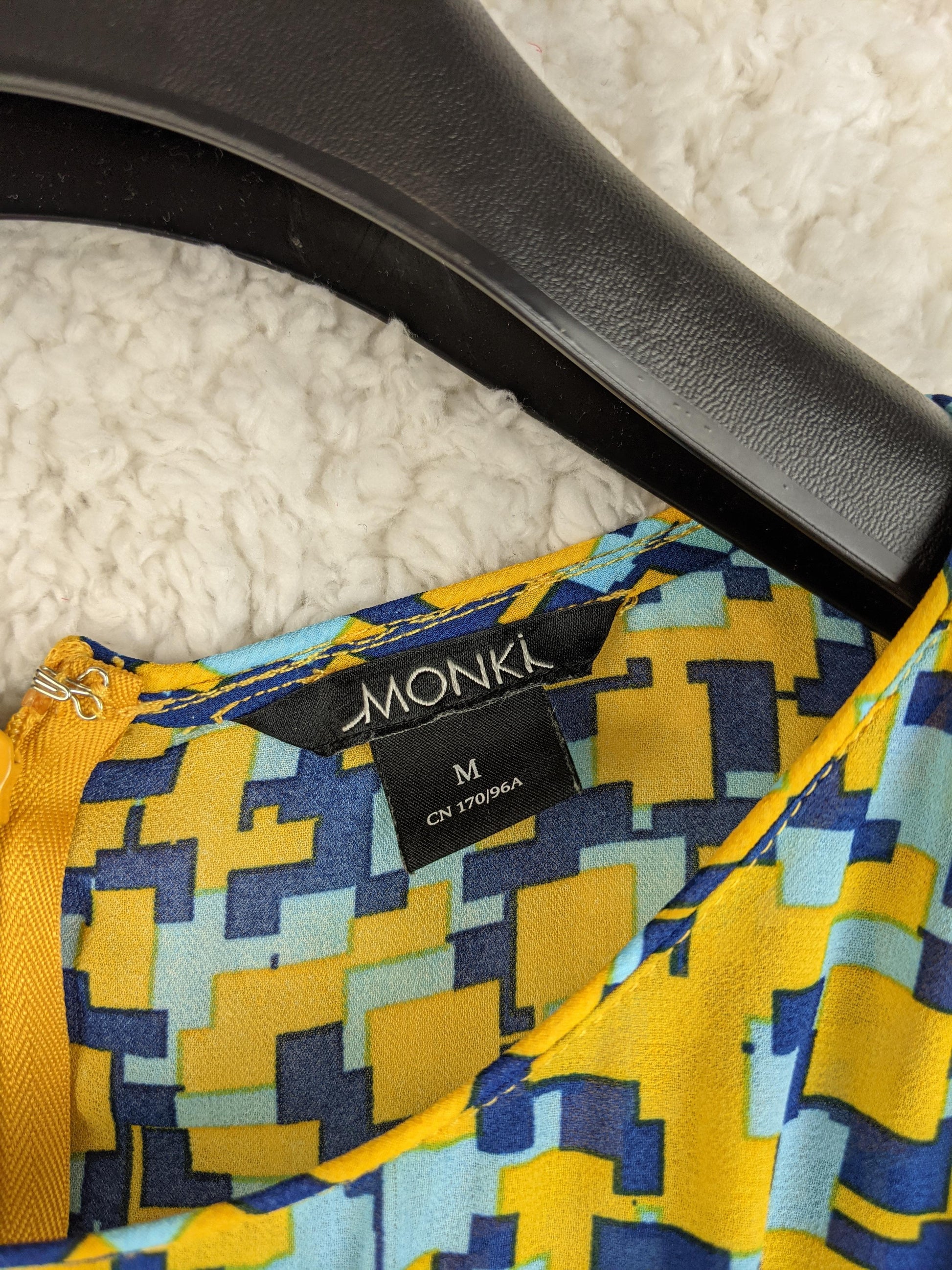 Close-up of Monki dress label