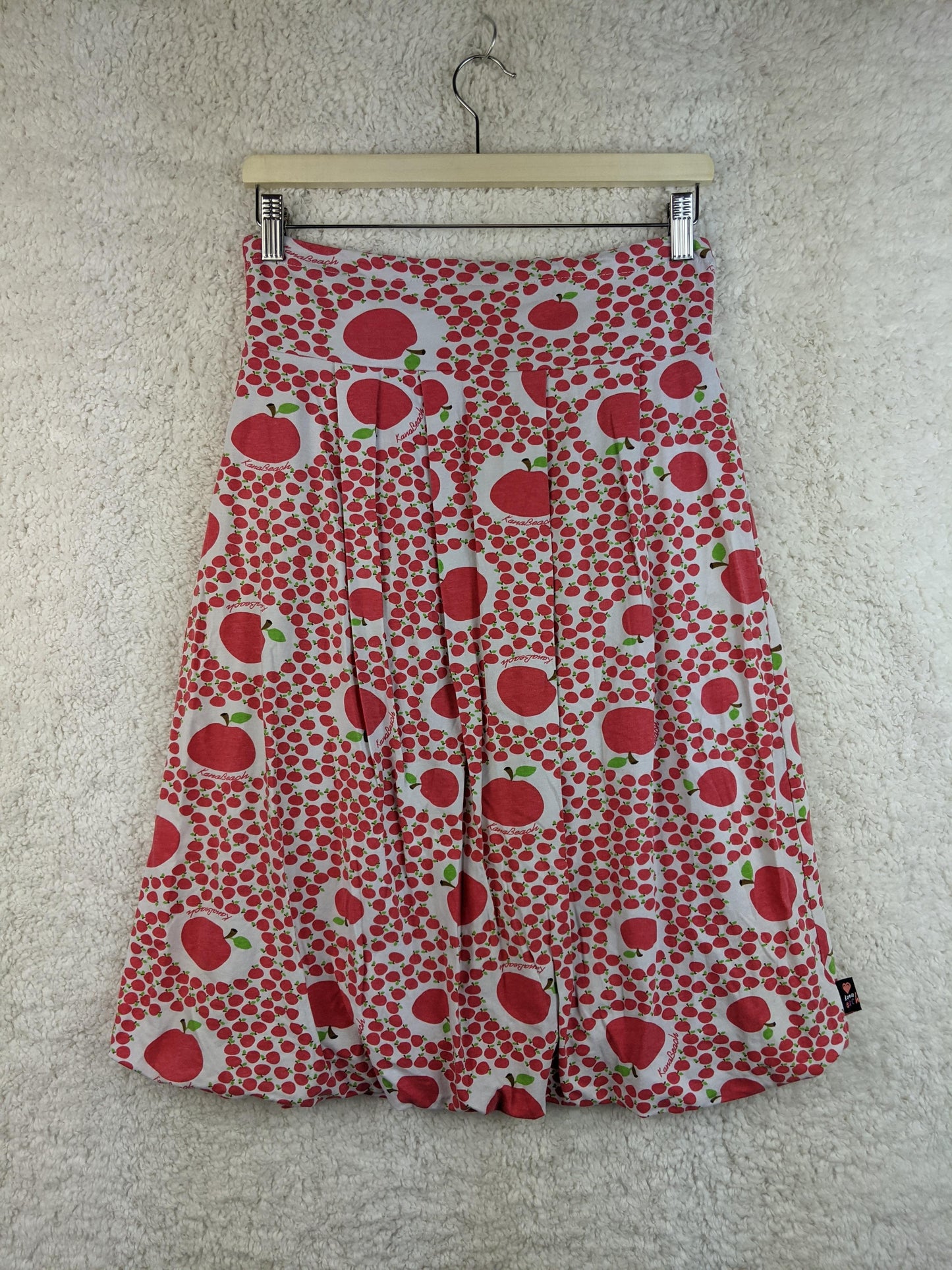 Front view of KanaBeach apple print skirt