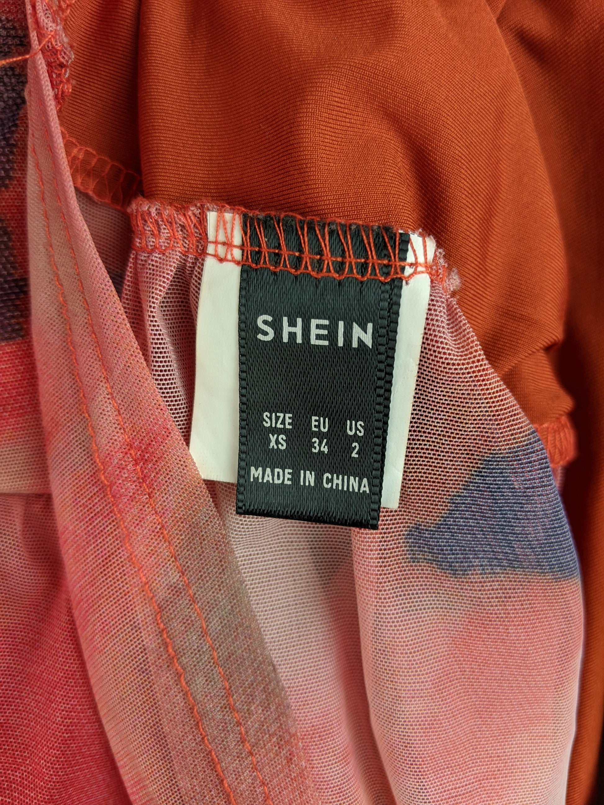 Size tag of Shein dress showing XS