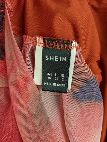 Size tag of Shein dress showing XS