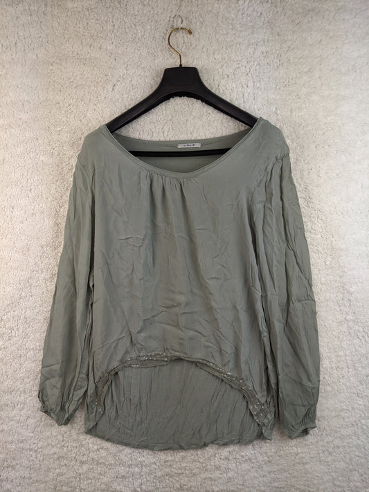 Front view of sage green blouse on hanger
