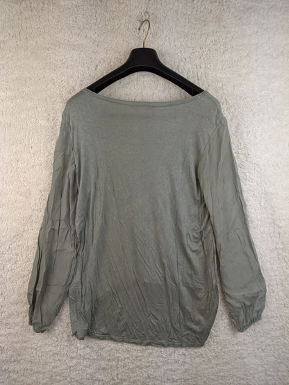Back view of sage green blouse on hanger