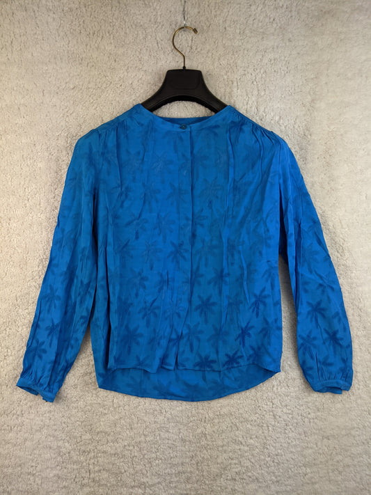 Blue floral blouse on a hanger - front view