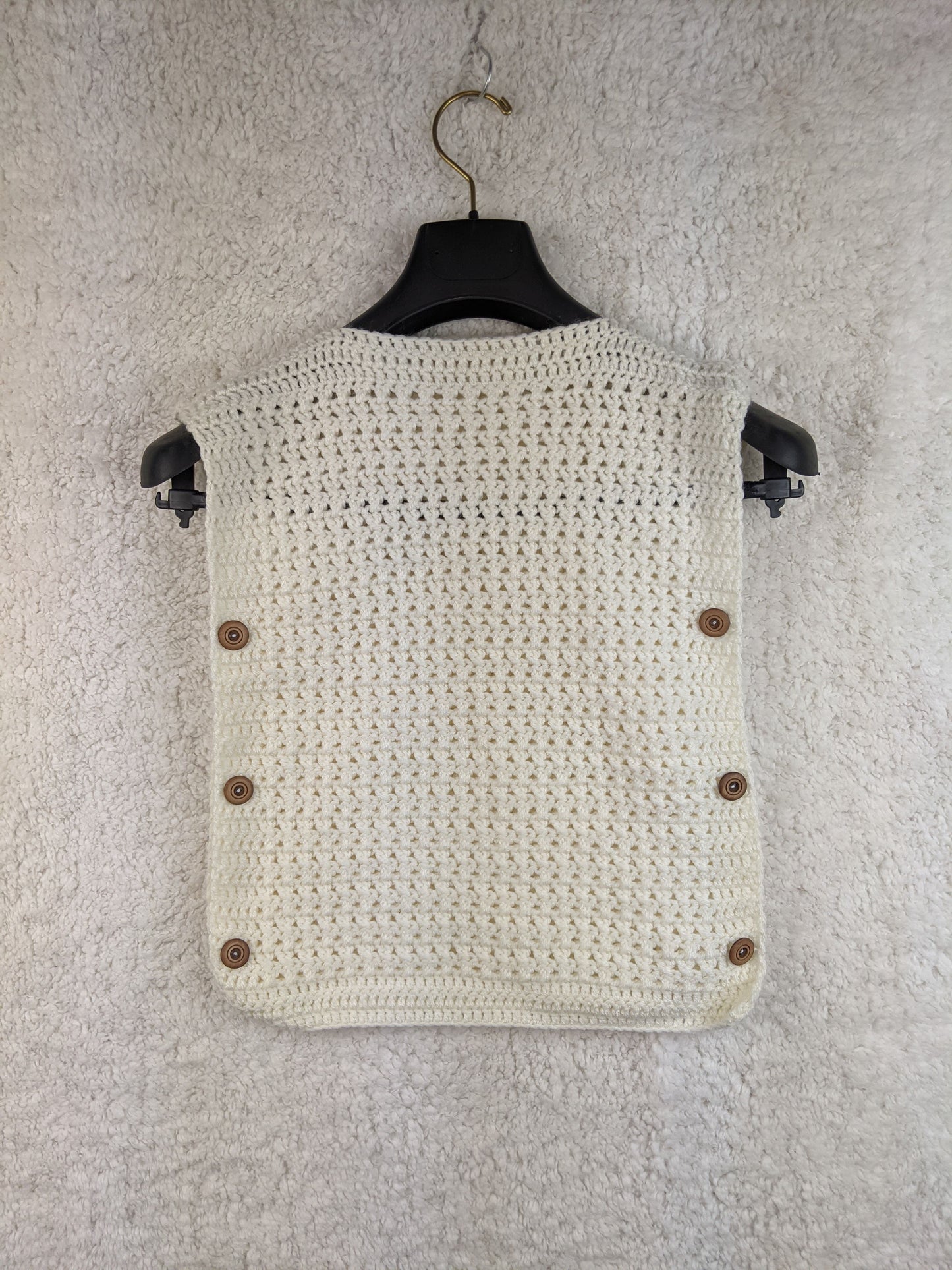 Handmade white crochet vest with buttons, back view