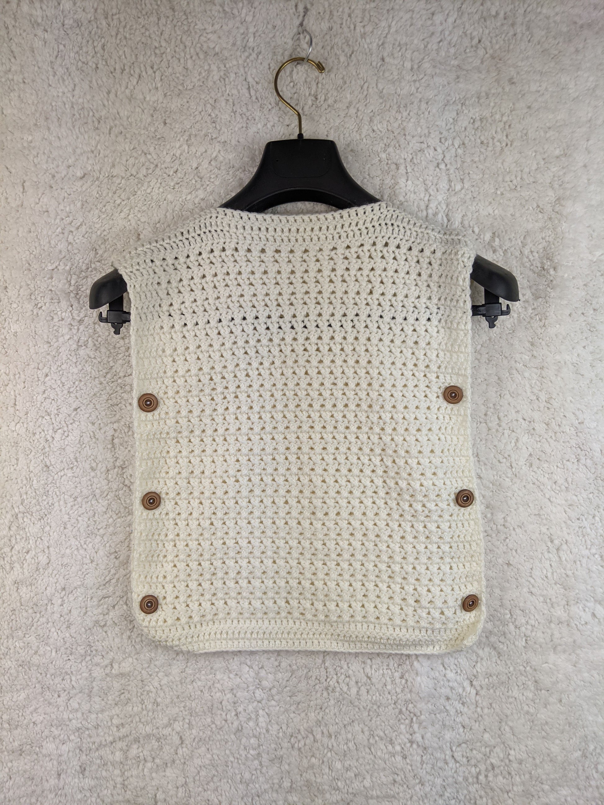 Handmade white crochet vest with buttons, back view
