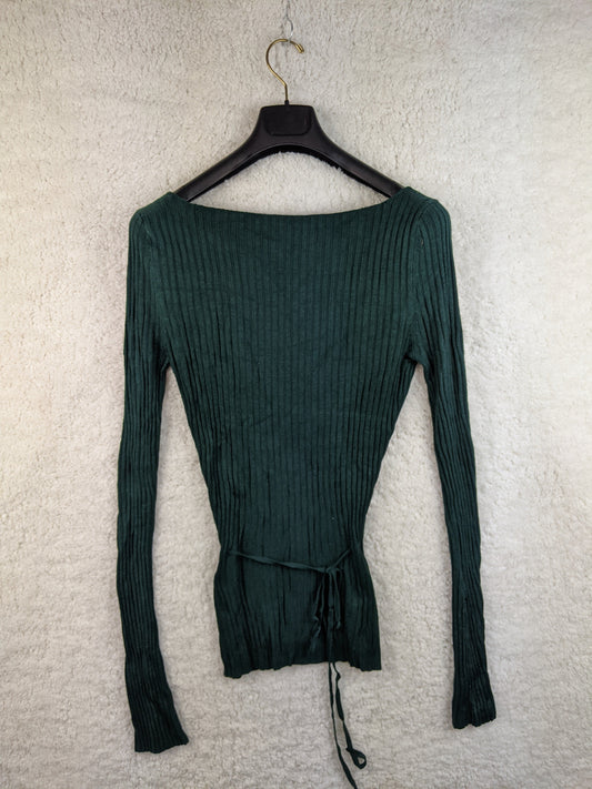 Front view of green ribbed knit top on hanger