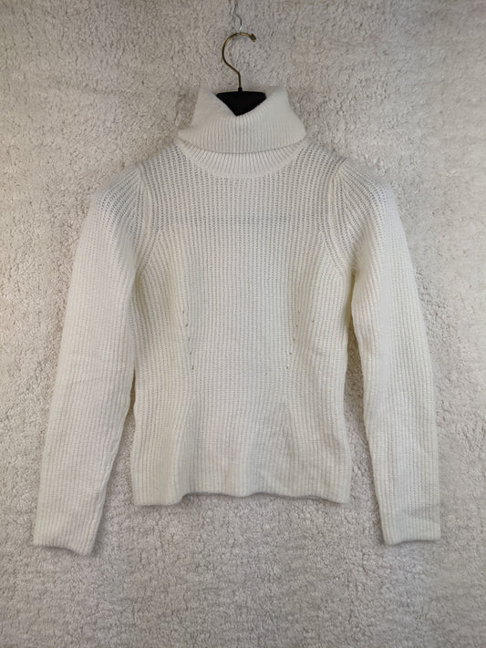 Front view of white ribbed turtleneck sweater