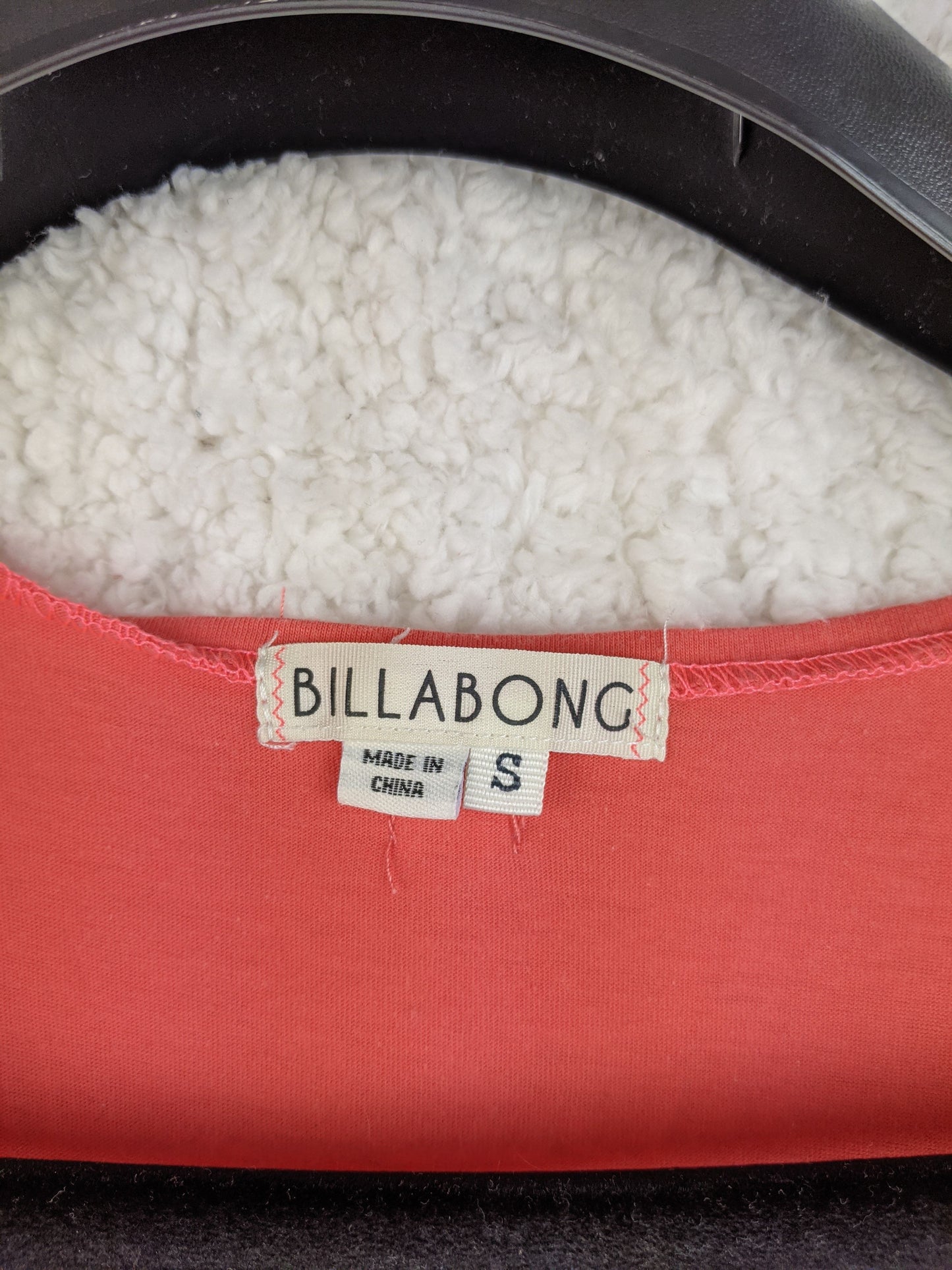 Close-up of Billabong tag showing size Small