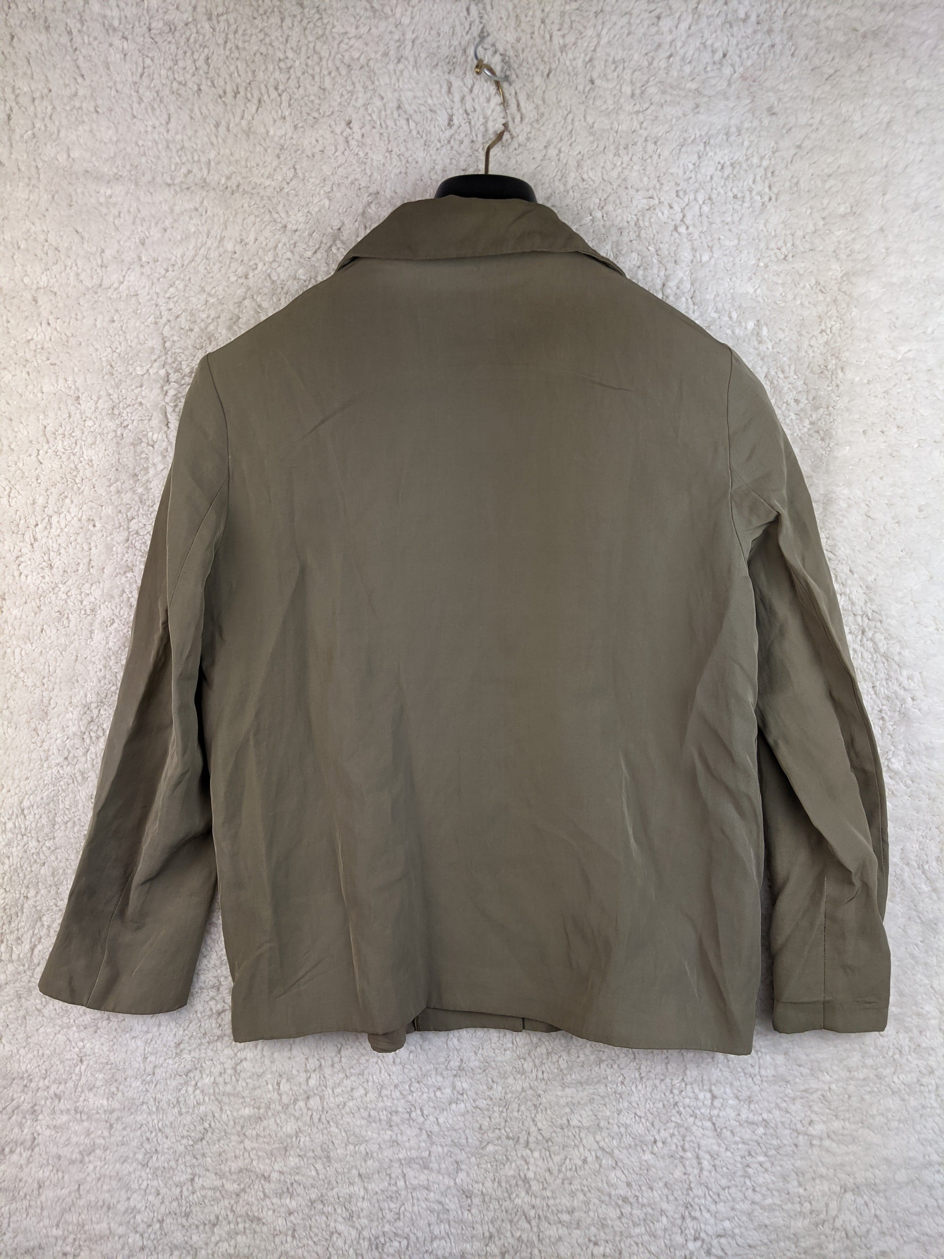 Back view of olive green jacket on hanger