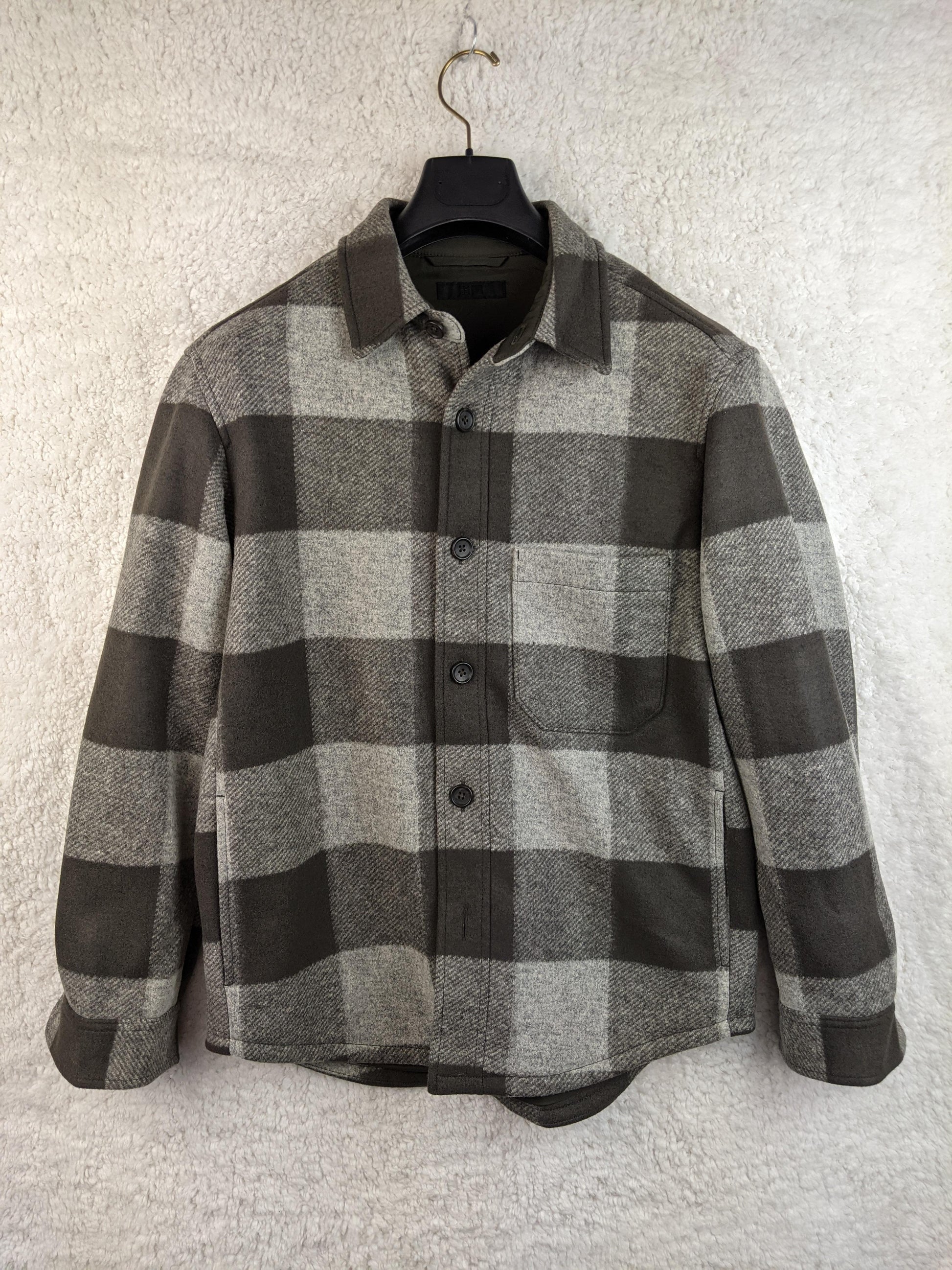 Front view of Uniqlo checkered overshirt in olive green and gray