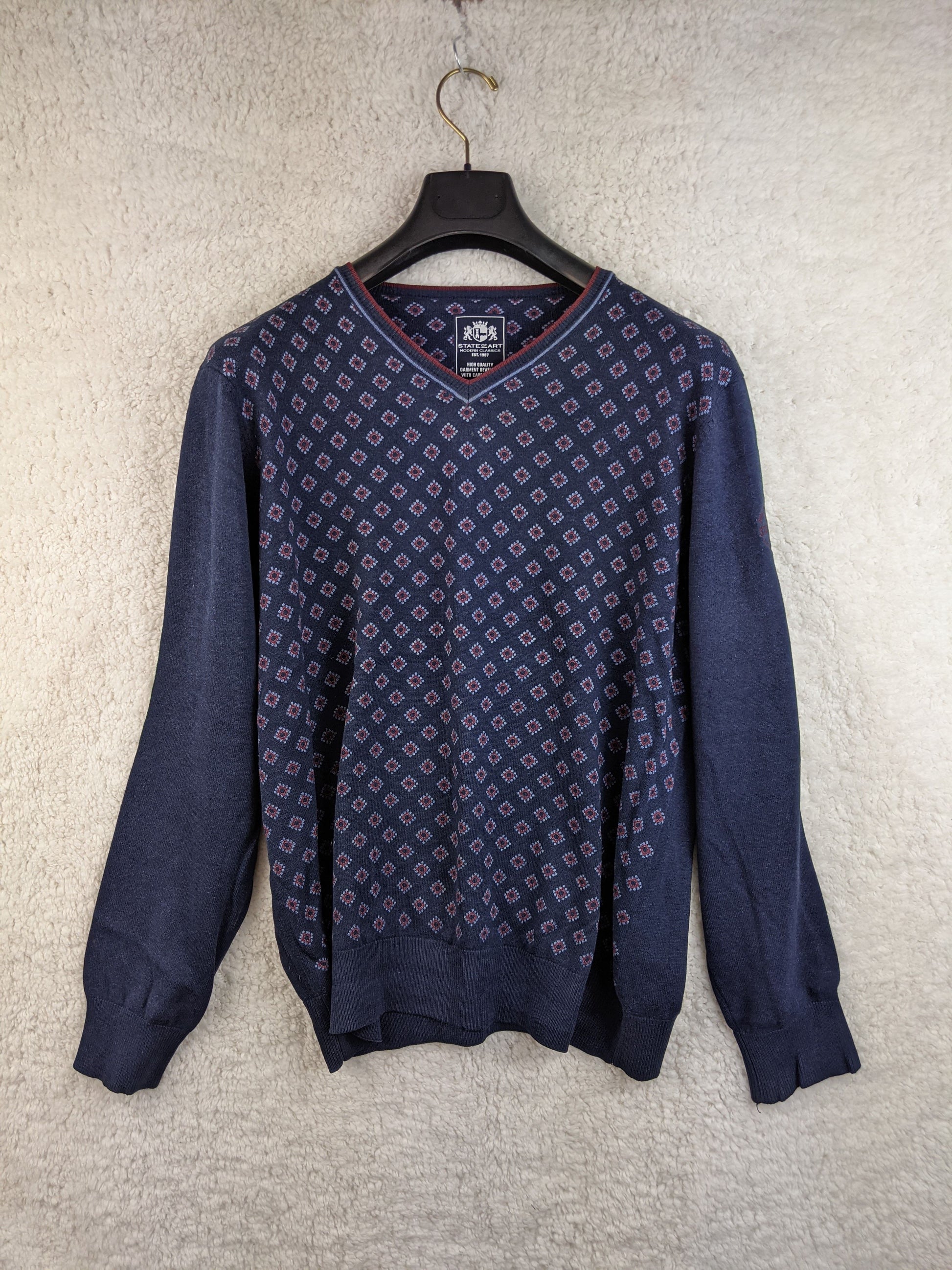 Front view of navy patterned sweater