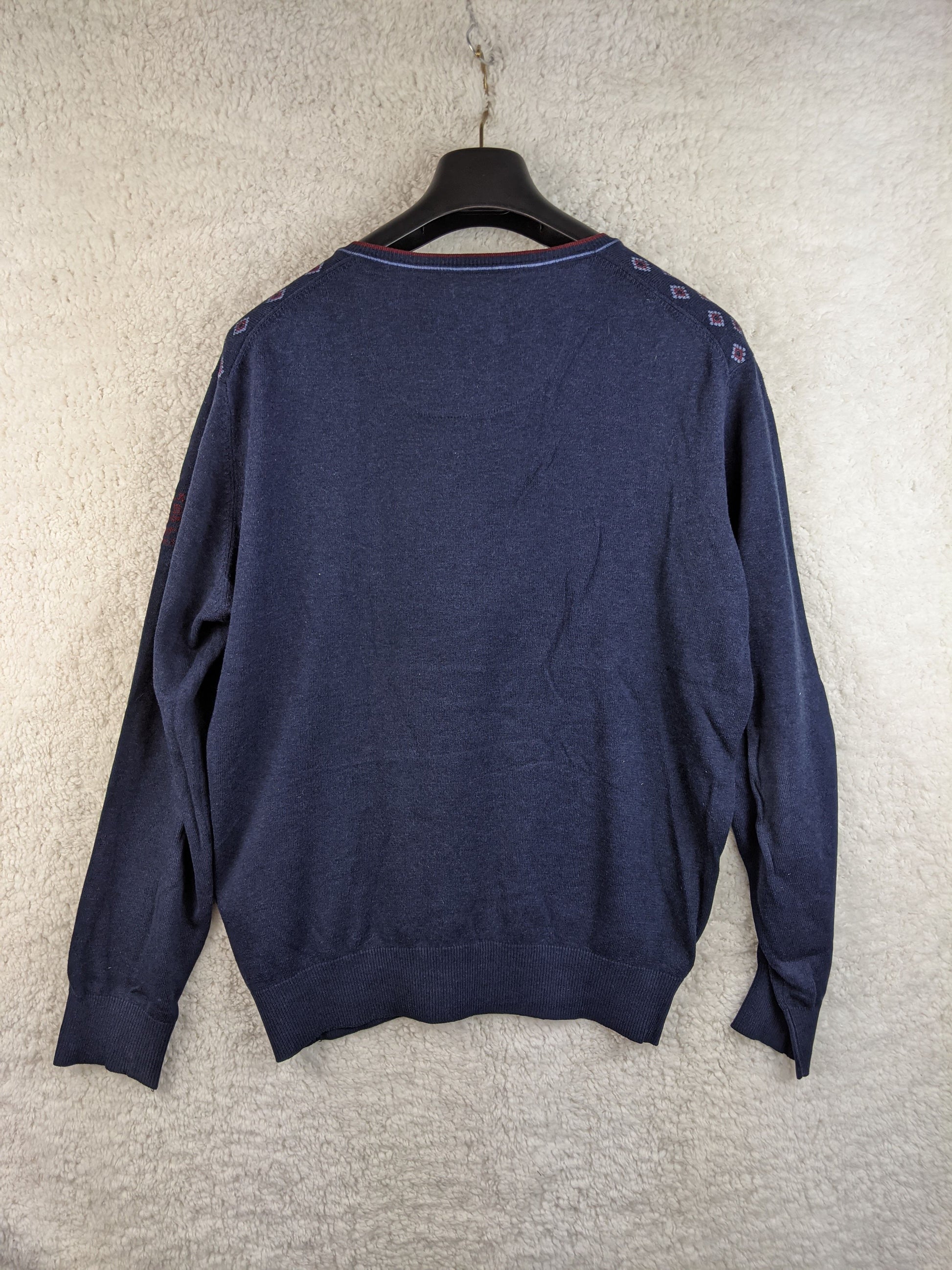 Back view of navy patterned sweater