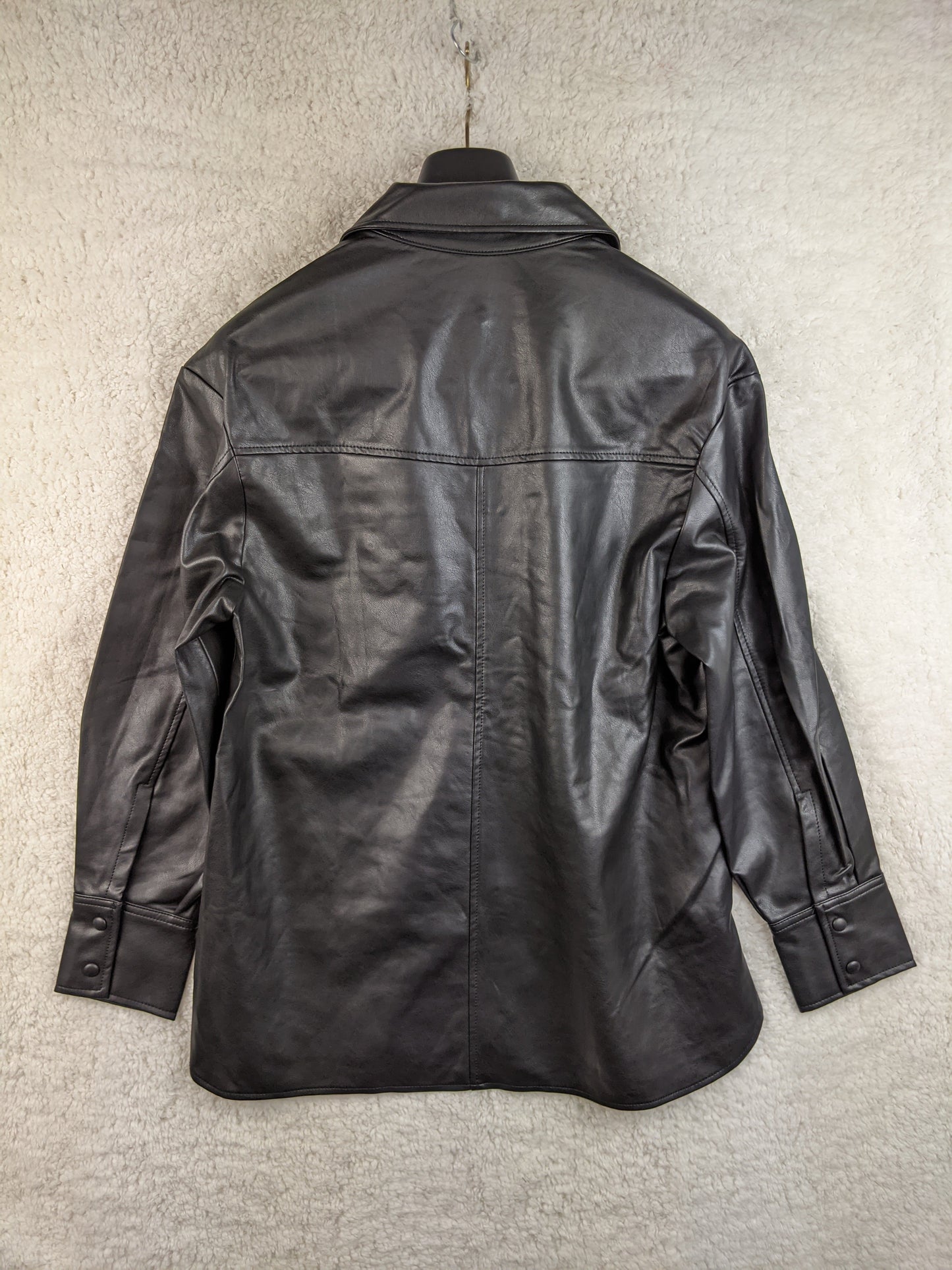 Back view of Mango black faux leather shirt