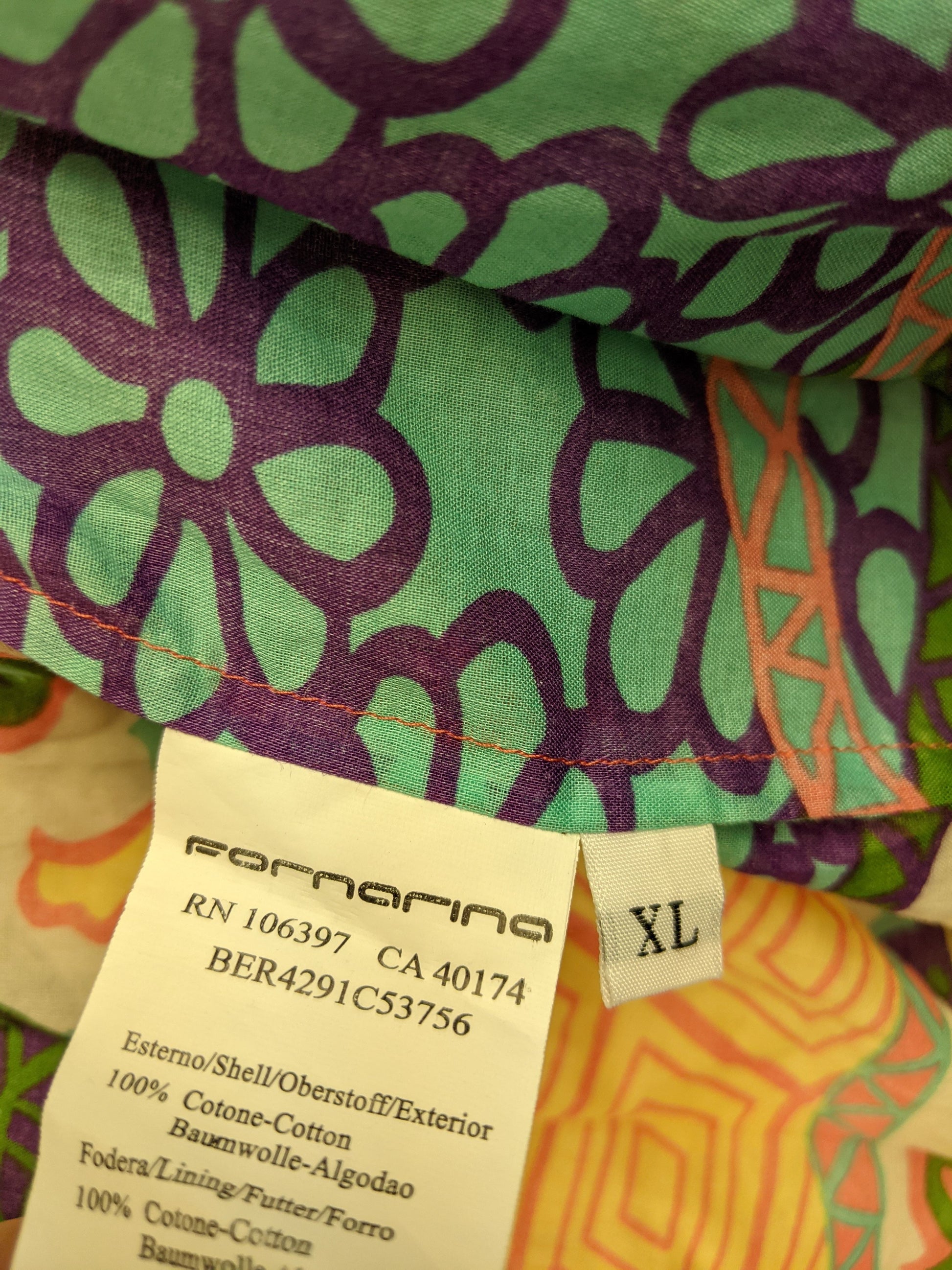 Size tag and material information of Fornarina blouse