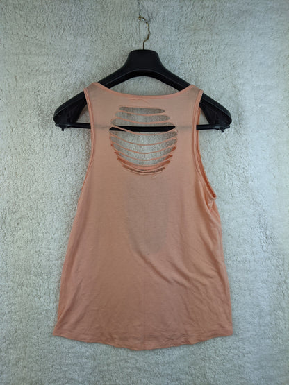 Back view of Rip Curl peach tank top showing cut-out details