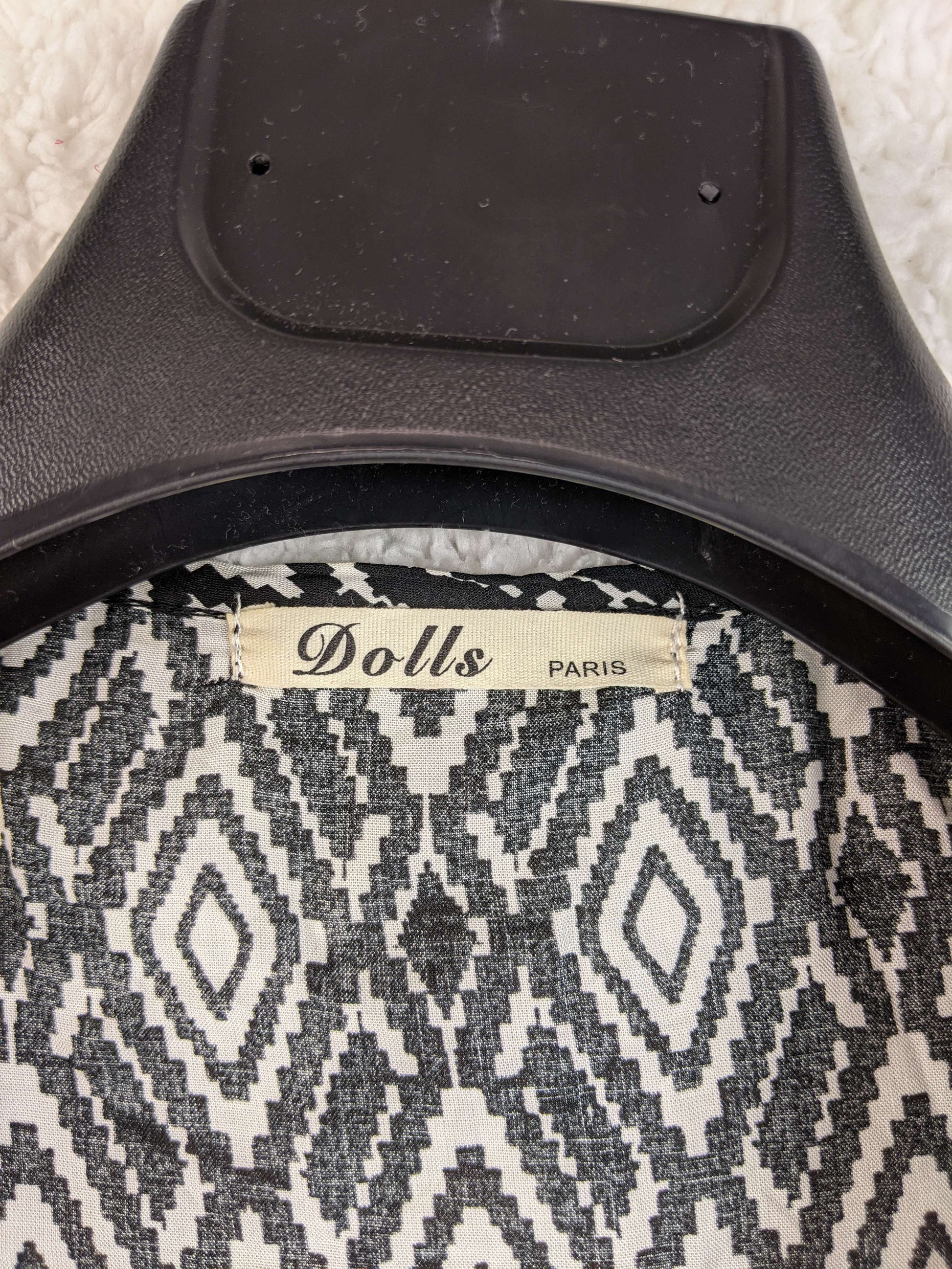 Close-up of Dolls Paris label
