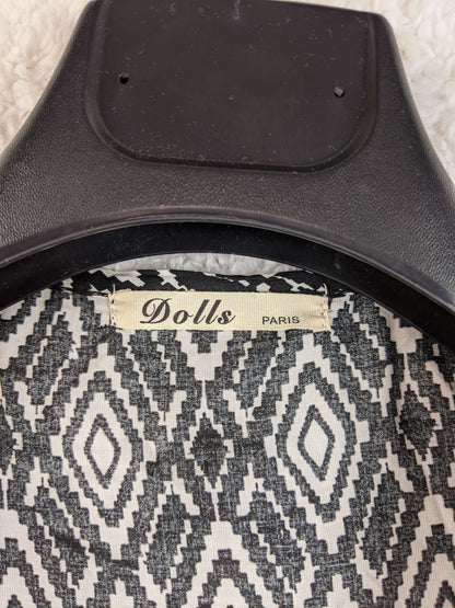 Close-up of Dolls Paris label