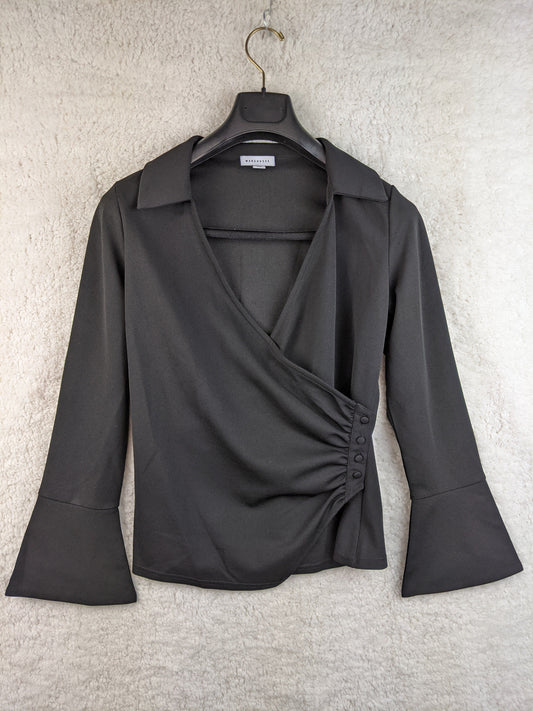Front view of black wrap blouse