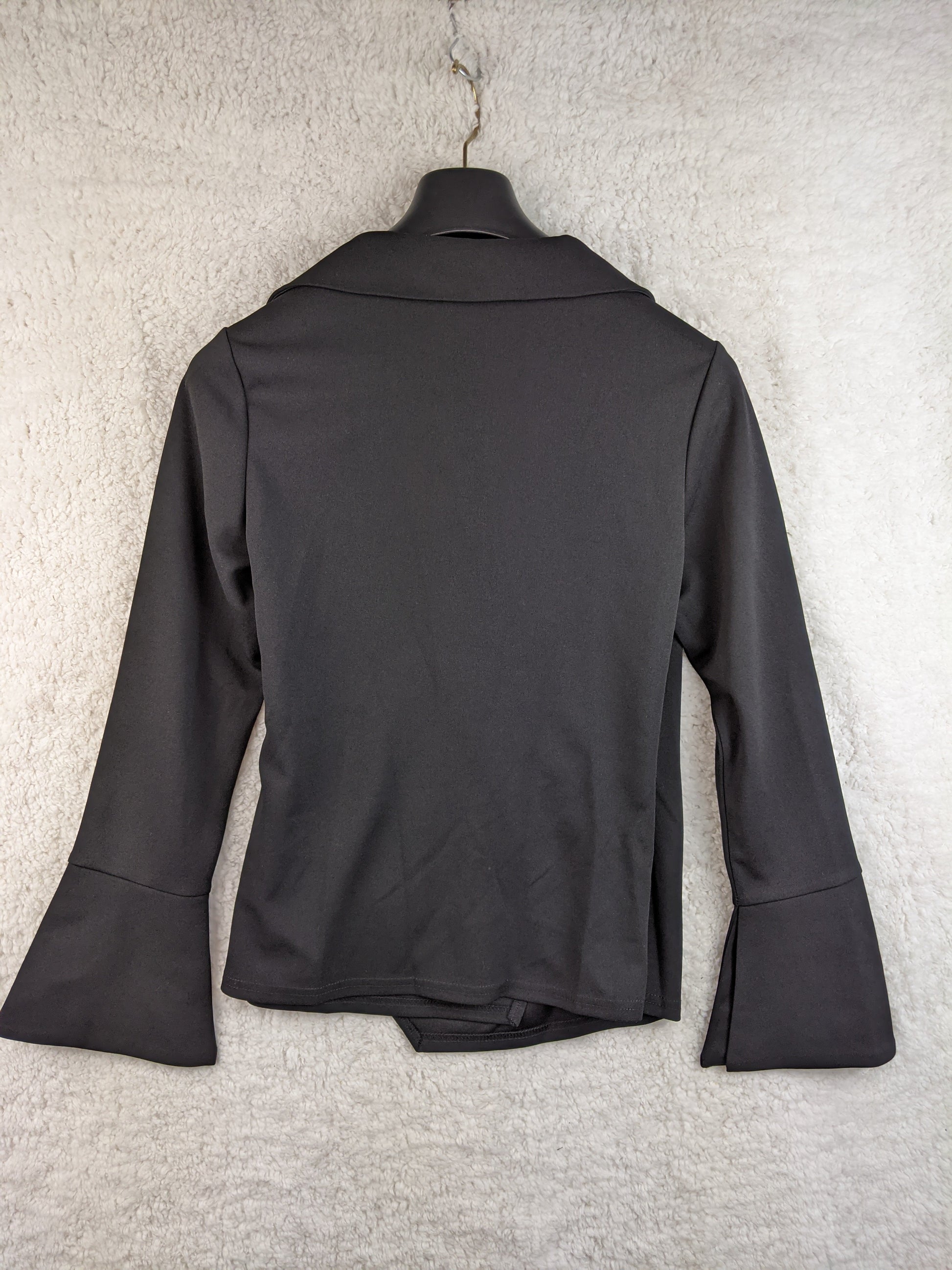 Back view of black wrap blouse