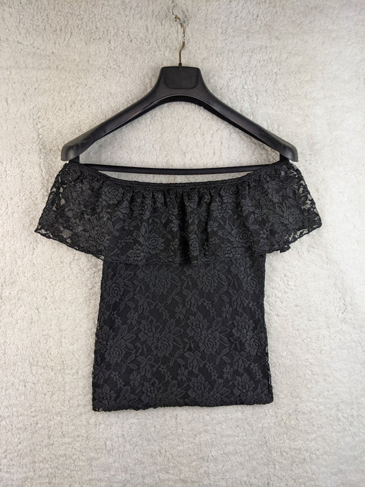 Black lace off-shoulder top on hanger front view