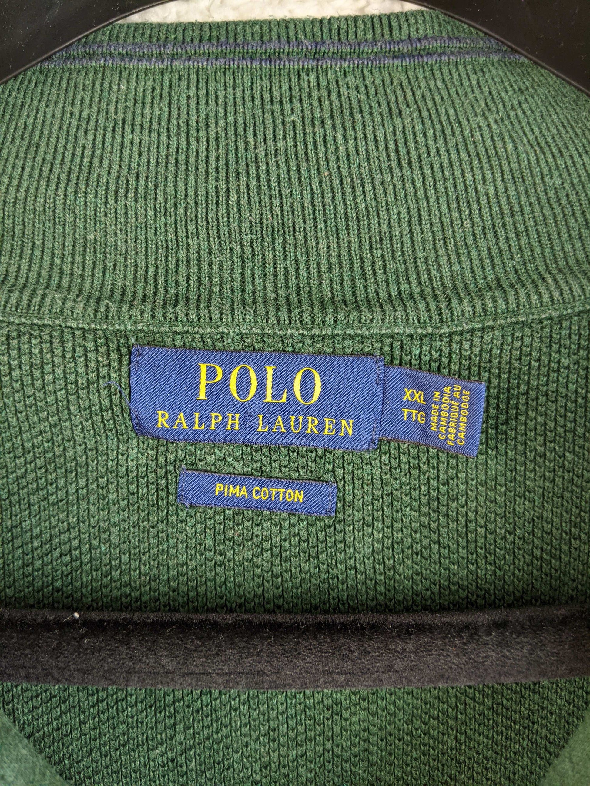 Close-up of Polo Ralph Lauren label on green sweater