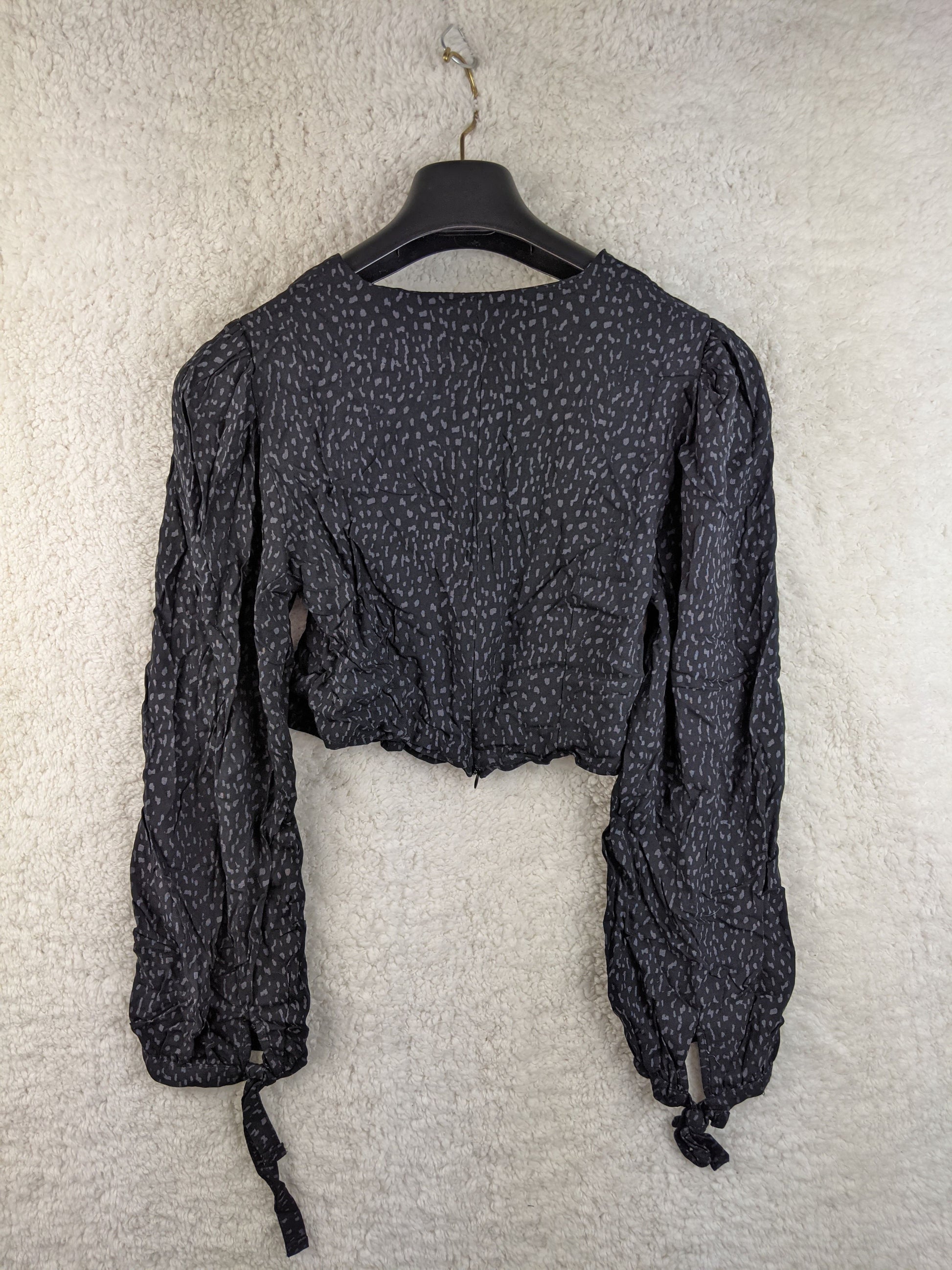 Back view of Trendyol black dotted blouse