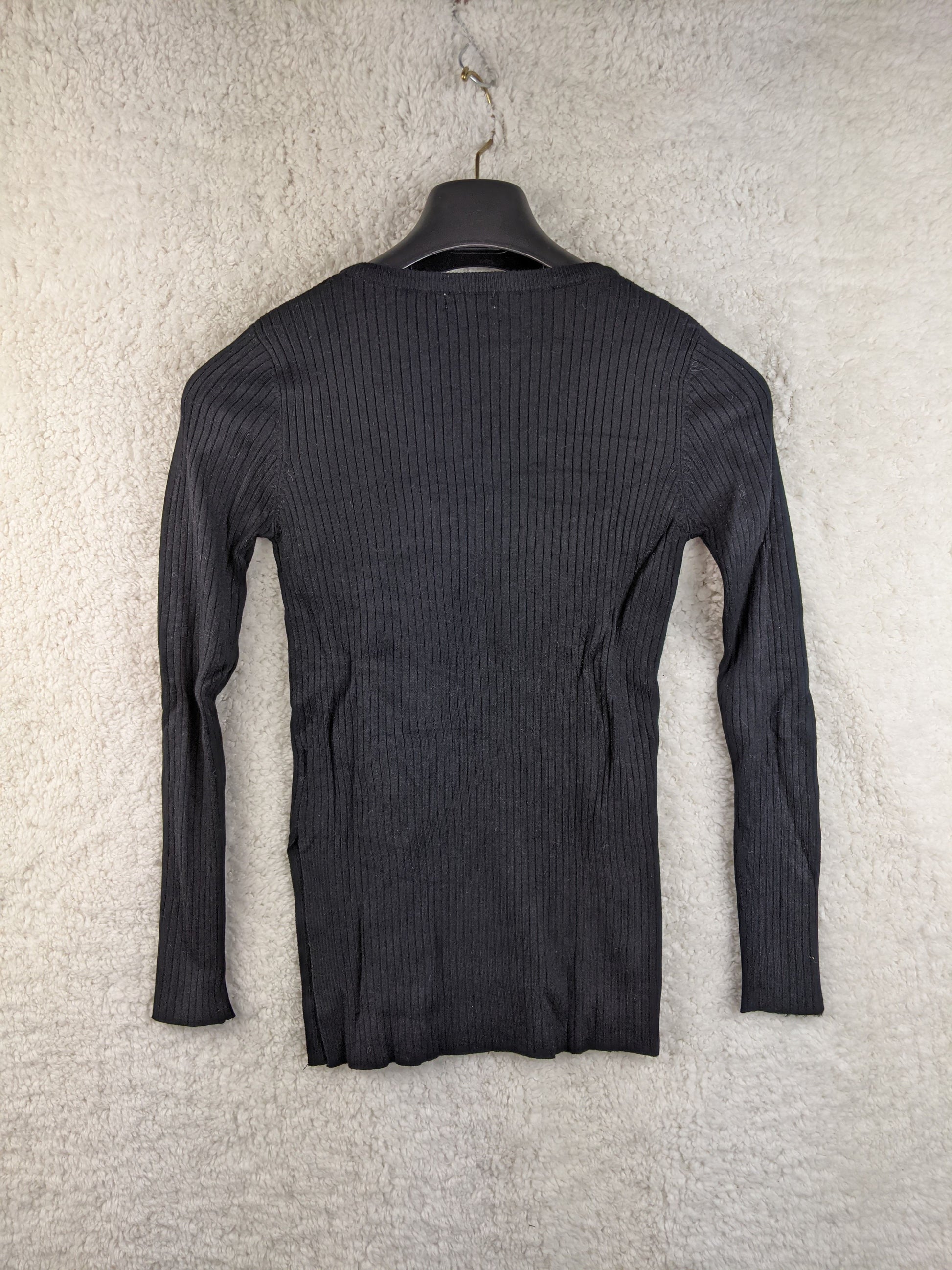 Back view of black ribbed knit sweater