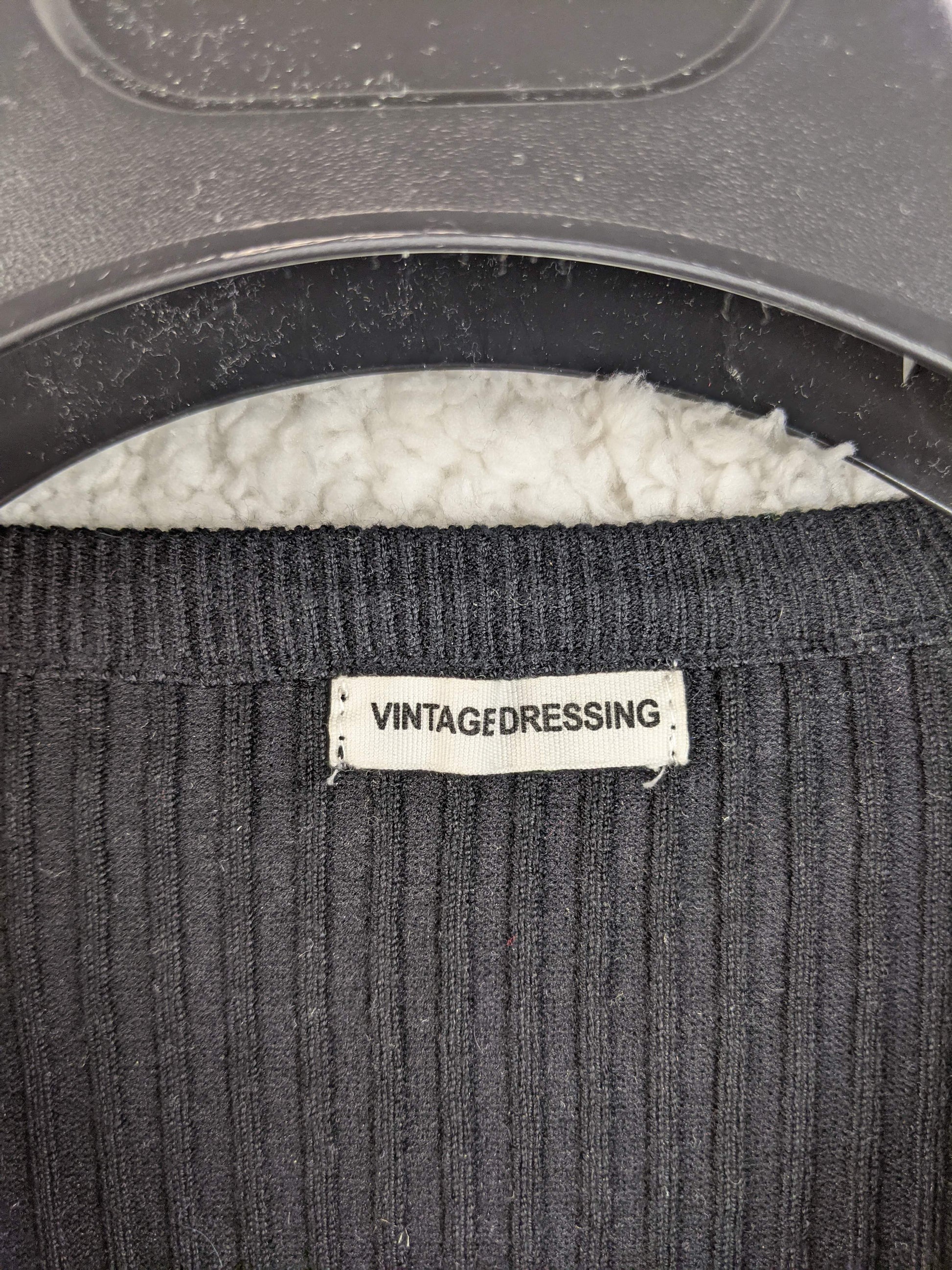 Close-up of Vintagedressing label on sweater