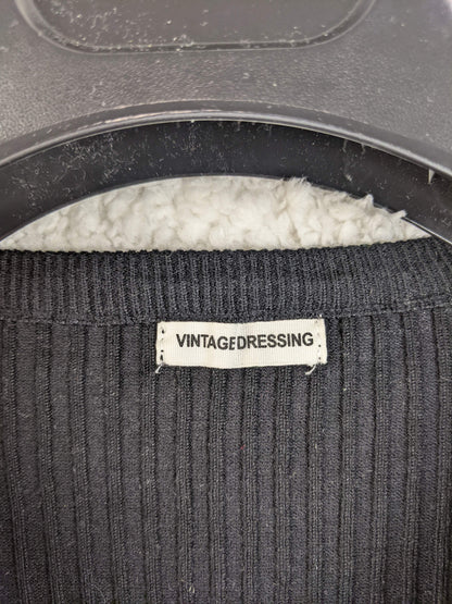 Close-up of Vintagedressing label on sweater