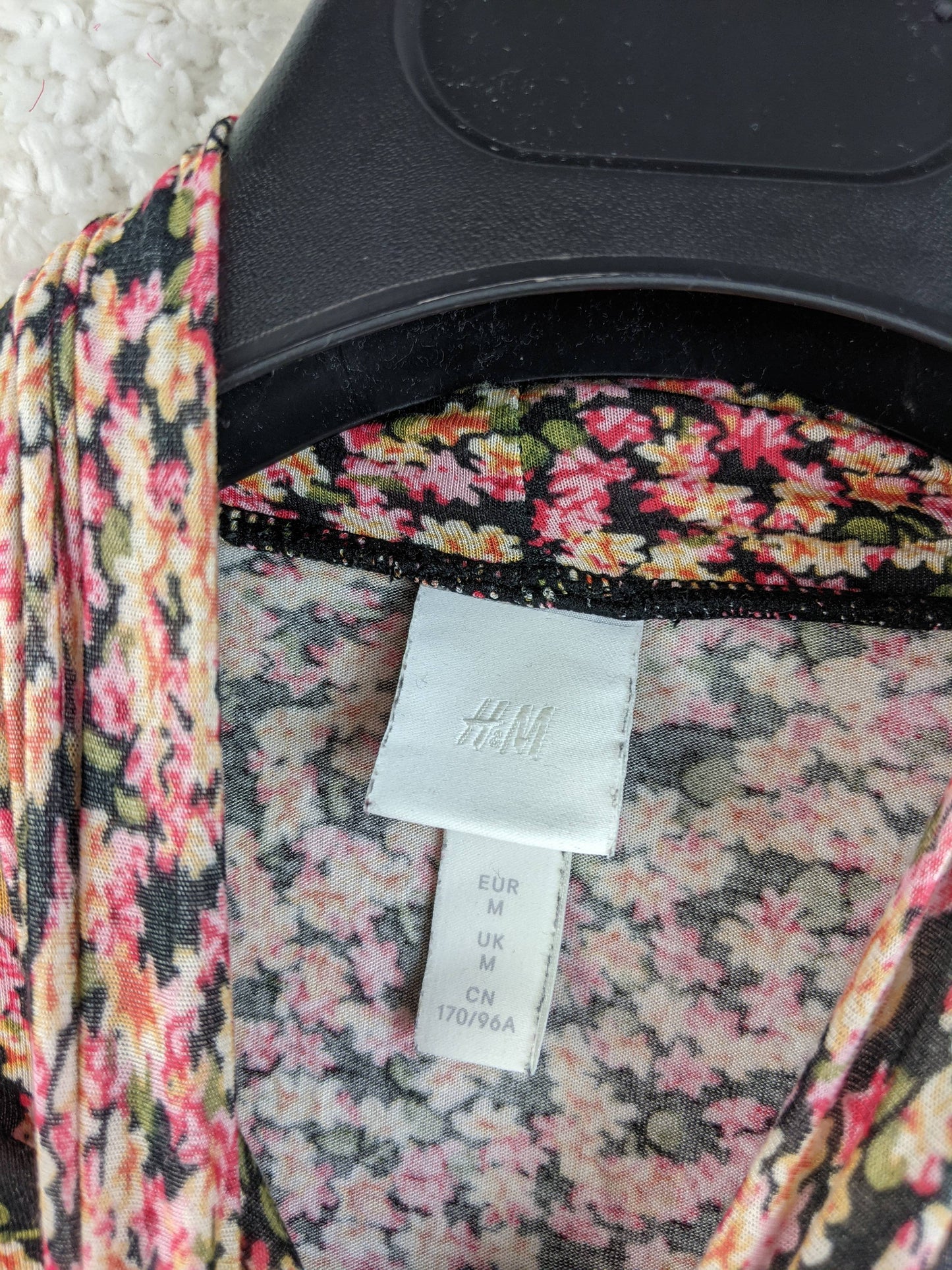Close-up of the H&M label inside the top