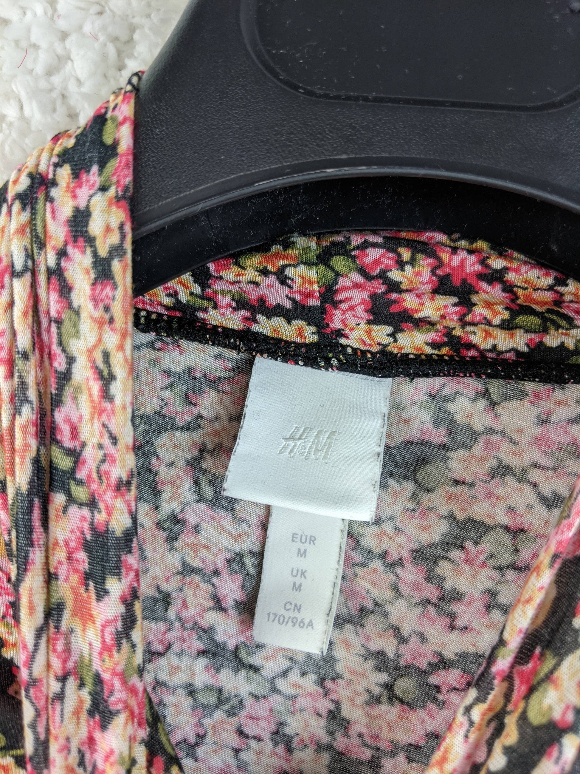 Close-up of the H&M label inside the top