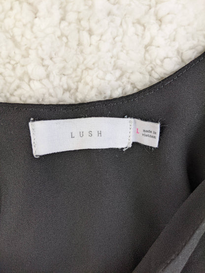 Label of Lush black cami top