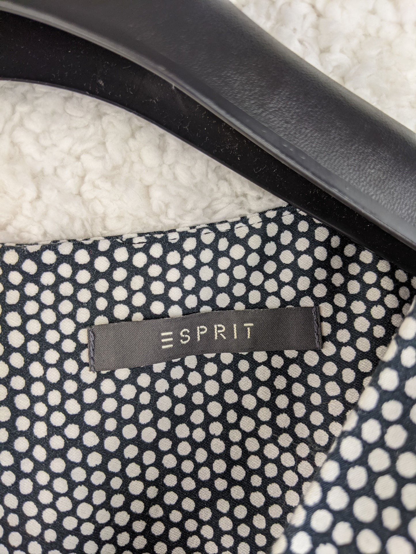 Close-up of Esprit brand label on the dress