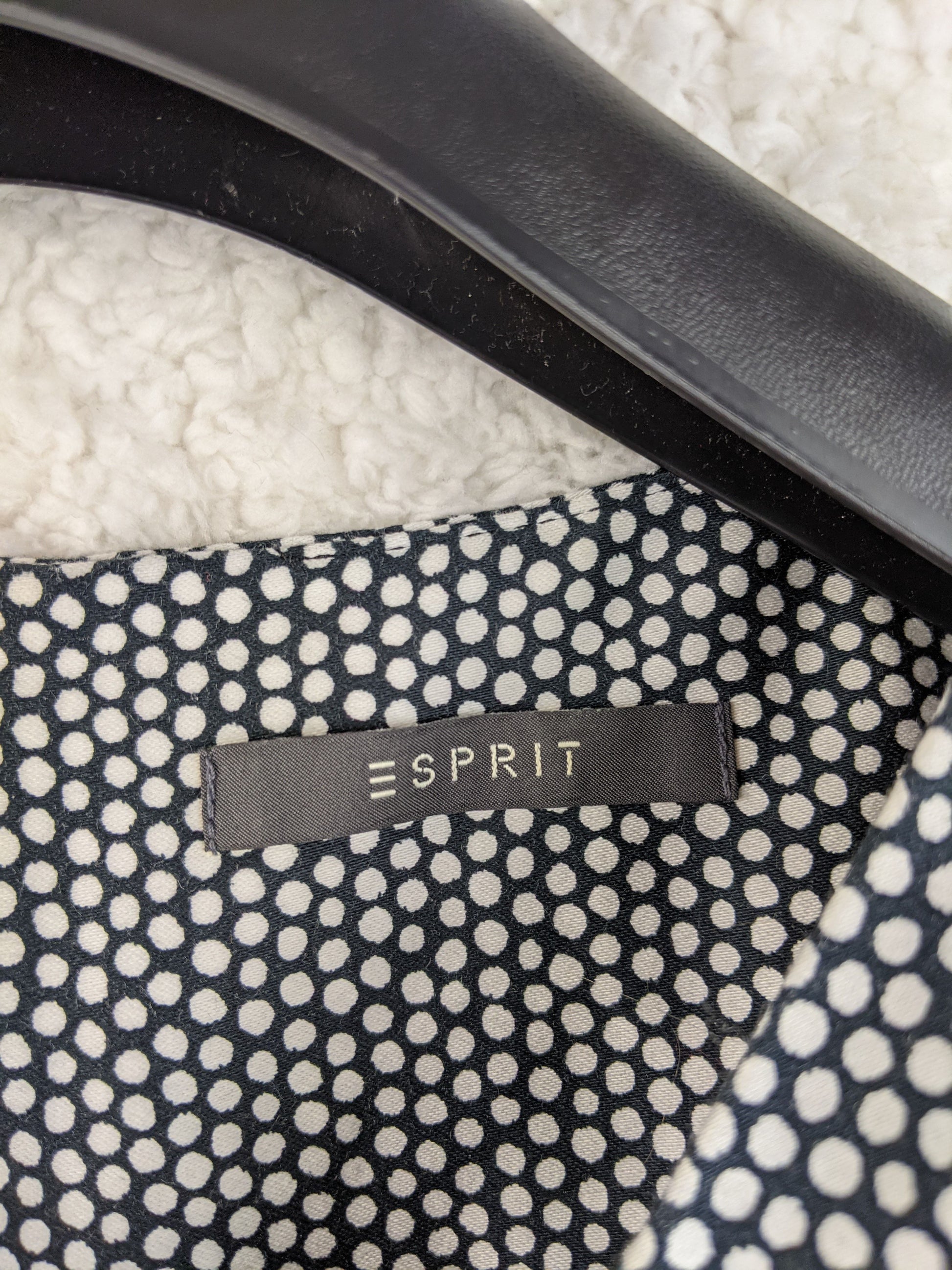 Close-up of Esprit brand label on the dress
