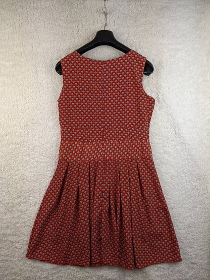 Back view of red patterned dress on hanger