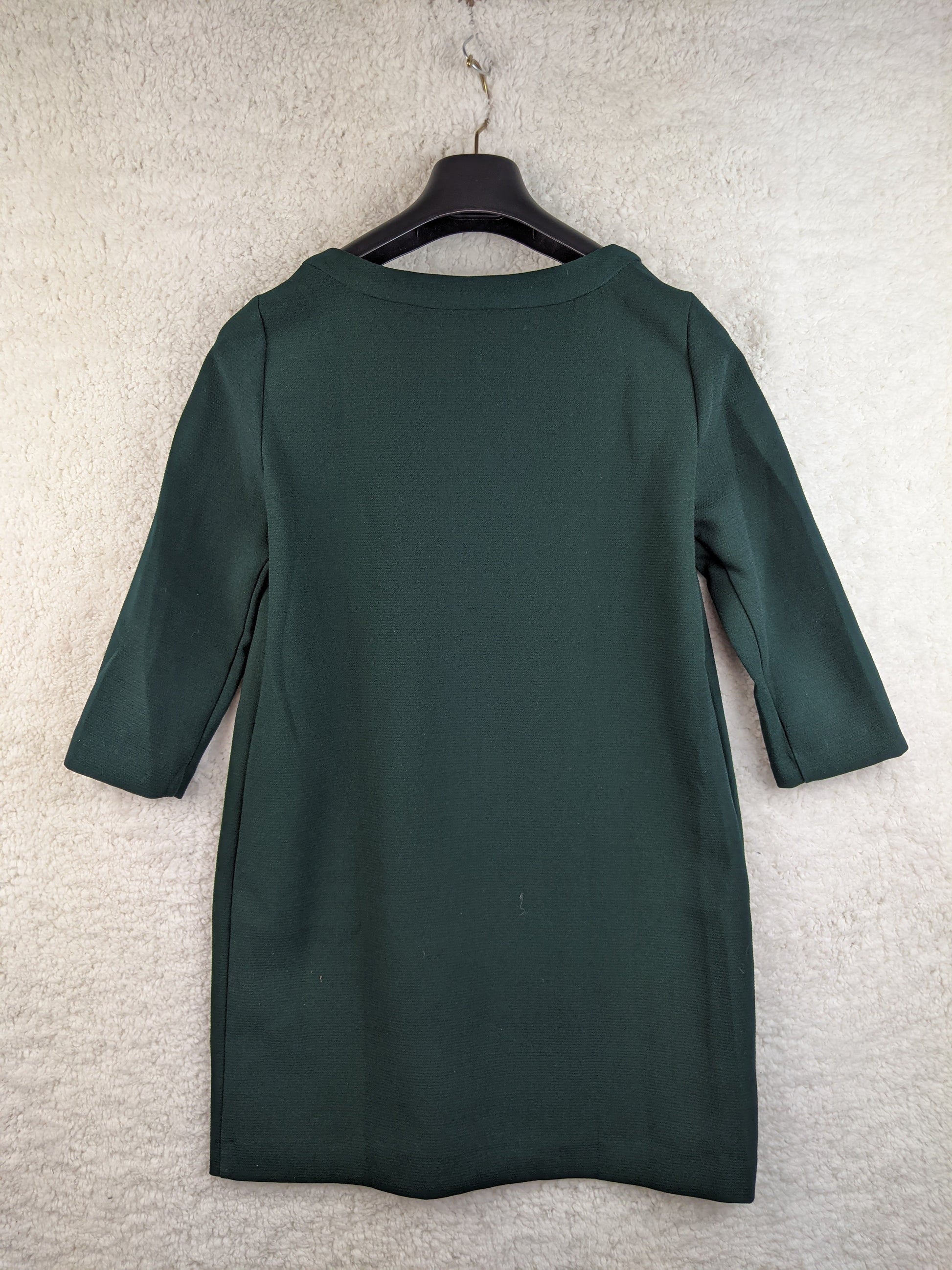 Back view of Mango dark green V-neck dress