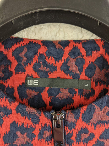 Close-up of label on WE red and black leopard print coat
